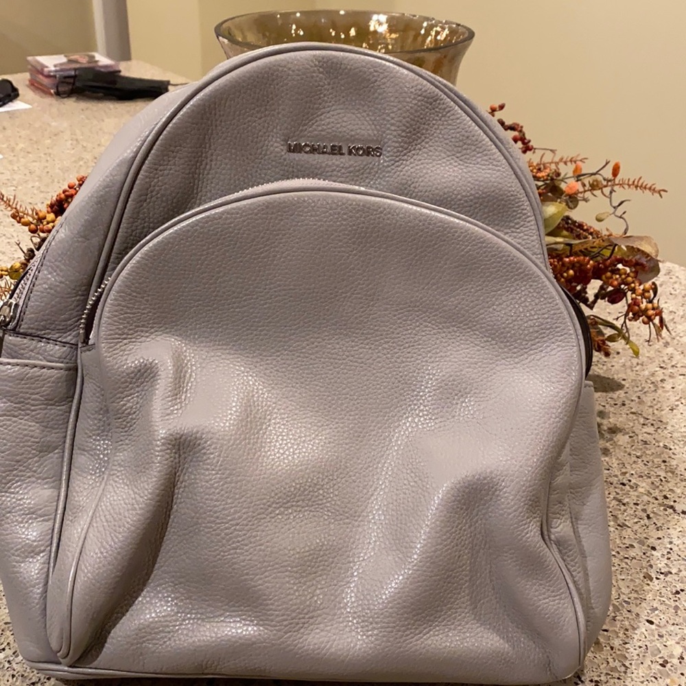 Like new grey Michael Kors backpack & matching wallet